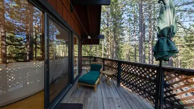 a porch with a bench and a chair on a deck at Secluded Incline Village Stay w Deck Near Diamond Peak Lake Cloud 9 and 12 by AvantStay in Incline Village