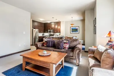 a living room with two couches and a coffee table at Solstice 8 in Mammoth Lakes