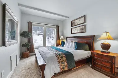 a bedroom with a bed and a window at Spacious Elegance-Kirkwood-Timber Ridge 3 Bedroom residence in Kirkwood