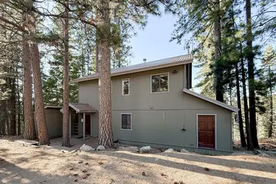a house in the woods with trees at Vernal Vista in Yosemite West