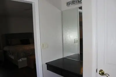 a room with a glass door with a room with a bed at Luxurious 5-Bedroom Retreat with Saltwater Pool and Spa in Elk Grove