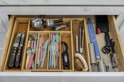 a drawer filled with utensils in a kitchen at New Reno Retreat 72 Inch TV Office Patio Views in Reno