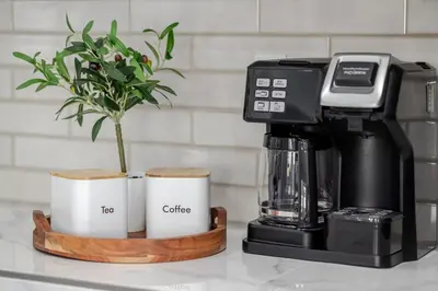 a coffee maker and two cups on a counter at New Reno Retreat 72 Inch TV Office Patio Views in Reno
