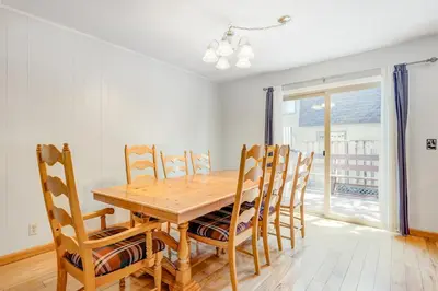 a dining room with a wooden table and chairs at Blue Lake Bliss in Tahoe City