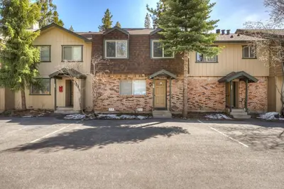 a large brick house with a parking lot at Blue Lake Bliss in Tahoe City