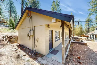 a small white building with a black roof at The Chalet at Kings Beach Unit 4 in Kings Beach