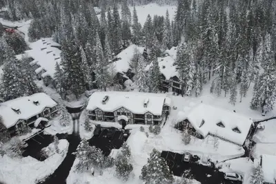 an aerial view of a house covered in snow at Tavern 16 in Olympic Valley