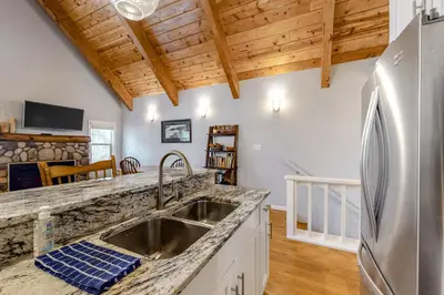 a kitchen with a sink and a refrigerator at Sierra Townhome in Incline Village