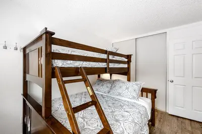 a bedroom with a bunk bed with a ladder at Sierra Townhome in Incline Village