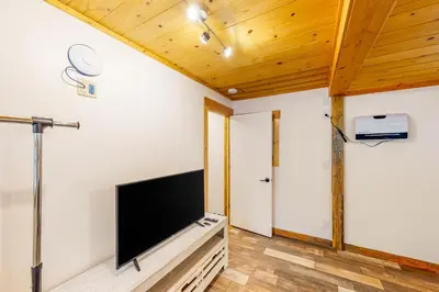 a living room with a flat screen tv on a wall at The Chalet at Kings Beach Unit 8 in Kings Beach