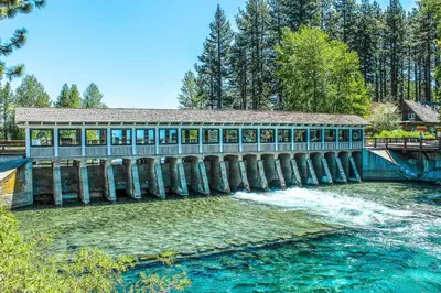 a bridge over a river with a building on it at Lake Forest Manor in Tahoe City