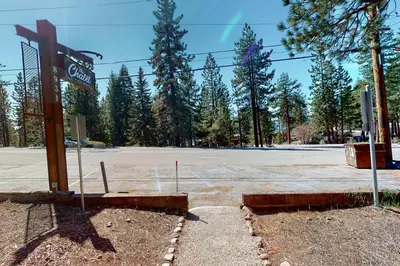 an empty parking lot with a sign for a gas station at The Chalet at Kings Beach Unit 7 in Kings Beach