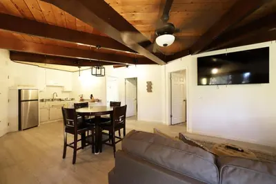 a living room with a couch and a table at Spacious 3BR Retreat - Sleeps 10 - Free Parking in Camino