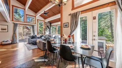 a dining room with a table and chairs at Year-Round Tahoe Escape with Hot Tub Outdoor Dining Timberline Haven by AvantStay in Tahoe Vista