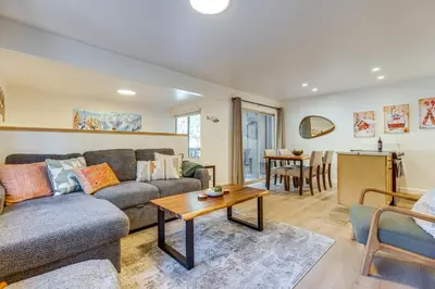 a living room with a couch and a table at Walk to Mammoth Village Chic Mountain Studio in Mammoth Lakes