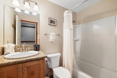 a bathroom with a toilet and a sink and a shower at 2 Bedroom Kirkwood Condo – Across the Street from Village condo in Kirkwood