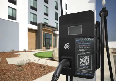a electricity meter in front of a building at Hilton Garden Inn Merced in Merced