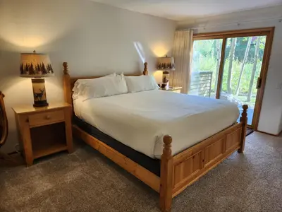a bedroom with a large bed and a window at Snowcreek Resort Vacation Rental 934 in Mammoth Lakes