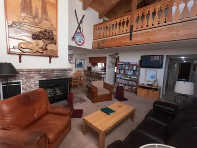 a living room with a couch and a fireplace at Rr-interlaken 09 in June Lake