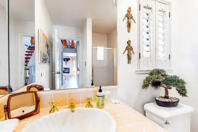 a bathroom with a white sink and a toilet at Tahoe Safari in Incline Village