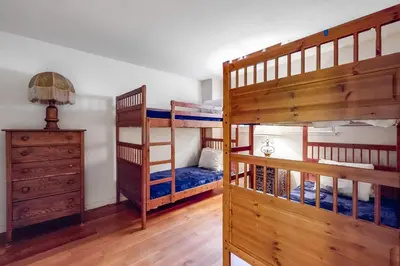 a bedroom with two bunk beds and a dresser at Tahoe Safari in Incline Village