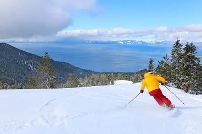 a person is skiing down a snow covered slope at Tahoe Safari in Incline Village