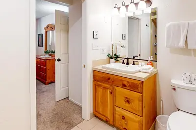 a bathroom with a sink and a toilet and a mirror at Moose Roost in Incline Village