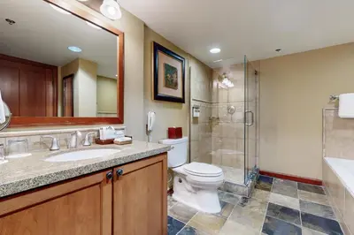 a bathroom with a sink and a toilet and a shower at Everline Resort & Spa 607B in Olympic Valley
