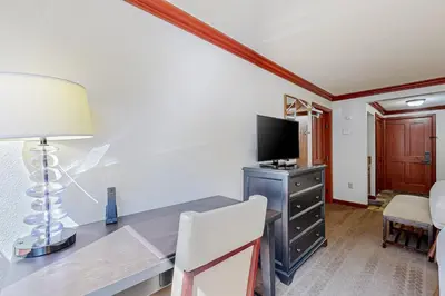 a room with a desk with a computer and a television at Everline Resort & Spa 523 in Olympic Valley