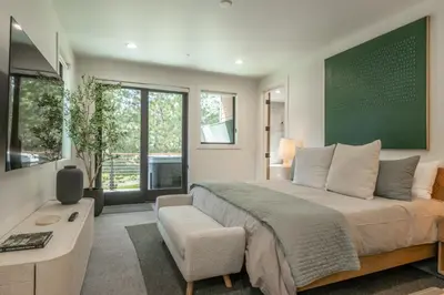 a bedroom with a large bed and a desk at The Reserve #126 in Mammoth Lakes