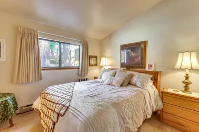 a bedroom with a bed and a window at Quiet Truckee Retreat with Deck, 5 Mi to Donner Lake in Truckee