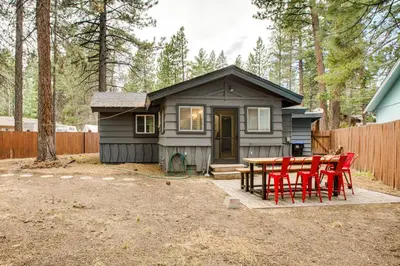 a small house with a table and chairs in front of it at Work and Play! Lake Tahoe Cabin 5 Mi to Heavenly Mtn in South Lake Tahoe