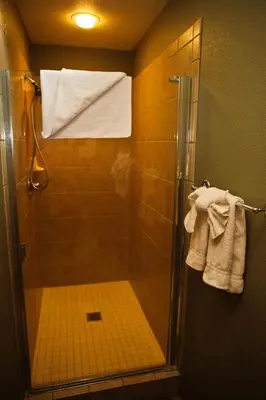 a shower with a glass door in a bathroom at Eagle Run # 204 in Mammoth Lakes