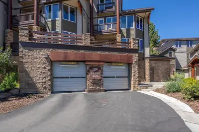 a house with two garage doors in a driveway at Eagle Run # 204 in Mammoth Lakes