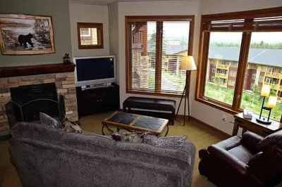 a living room with a couch and a fireplace at Eagle Run # 204 in Mammoth Lakes