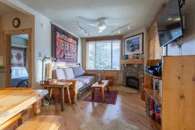 a living room with a couch and a fireplace at Juniper Springs Lodge # 426 in Mammoth Lakes