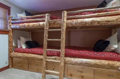 a couple of bunk beds in a room at Timbers # 1033 in Mammoth Lakes