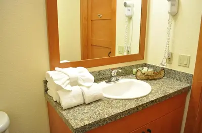 a bathroom counter with a sink and a mirror at Village # 2416 - White Mountain Lodge in Mammoth Lakes