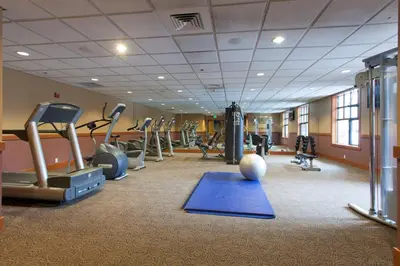 a gym with treadmills and exercise equipment in a room at Village # 2416 - White Mountain Lodge in Mammoth Lakes