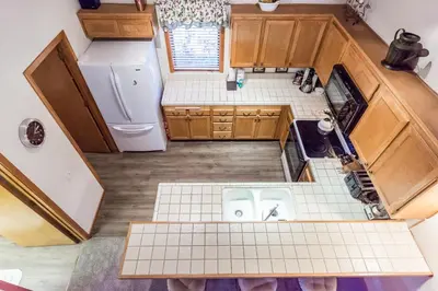 an overhead view of a kitchen with brown cabinets at Snowcreek #474 in Mammoth Lakes