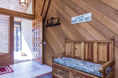 a room with a wooden wall with a sign on it at Snowcreek #474 in Mammoth Lakes