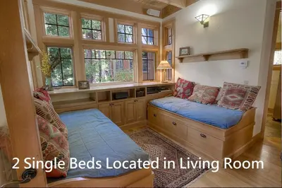 a room with two beds in a living room at COH1444 - Fallen Leaf Relief home in South Lake Tahoe