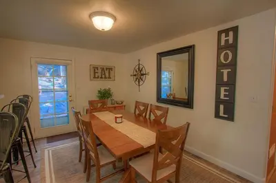 a dining room with a wooden table and chairs at NVH0823 - Sadies Hustle home in Zephyr Cove