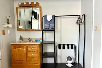 a bathroom with a sink and a refrigerator at Renovated Mountain Getaway, AC, Spa, Pool, Full Kitchen in Mammoth Lakes