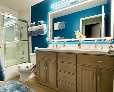 a bathroom with a sink and a toilet and a mirror at Renovated Mountain Getaway, AC, Spa, Pool, Full Kitchen in Mammoth Lakes