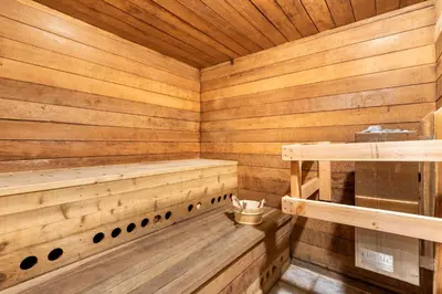 a wooden sauna with wooden floors and wooden ceilings at Renovated Mountain Getaway, AC, Spa, Pool, Full Kitchen in Mammoth Lakes