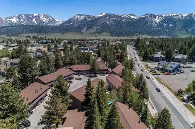 an aerial view of a town with trees and mountains at Renovated Mountain Getaway, AC, Spa, Pool, Full Kitchen in Mammoth Lakes