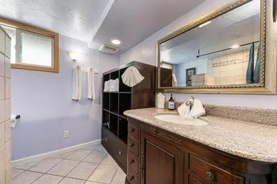 a bathroom with a sink and a large mirror at Retreat with Private Hot Tub steps North Lake Tahoe in Carnelian Bay