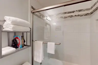 a bathroom with a shower with a glass door at Brown Bear's Hideaway in Incline Village
