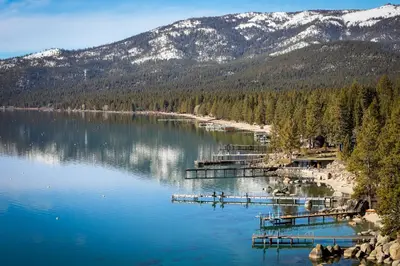 a view of a lake with mountains in the background at Brown Bear's Hideaway in Incline Village